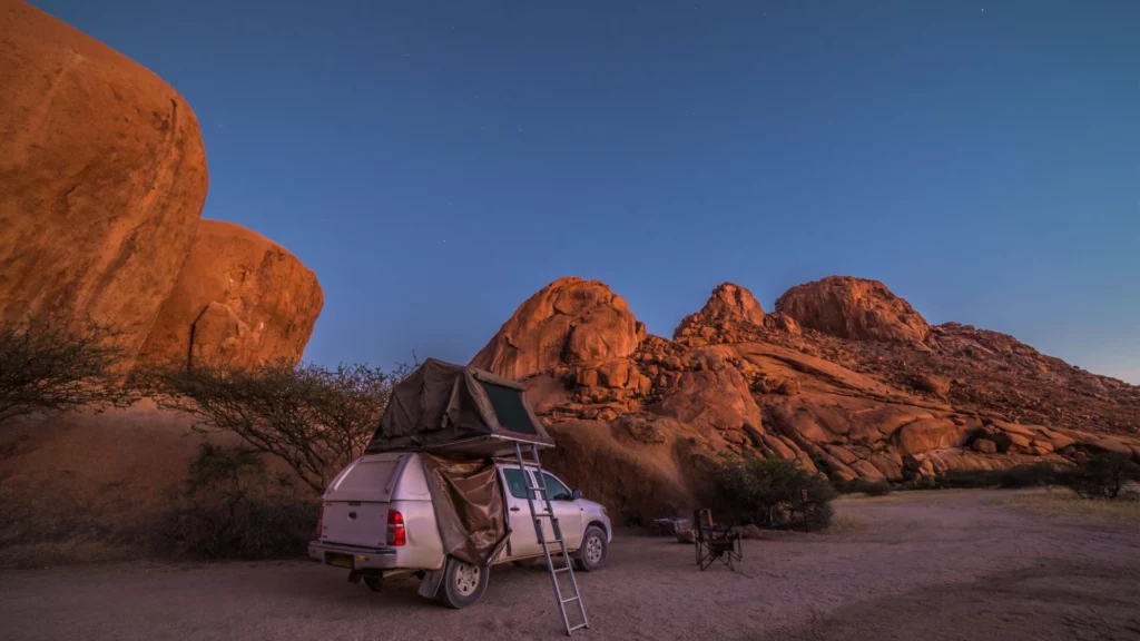 Self-drive Safari, Spitzkoppe, Namibia: Camping with a 4x4 car (Toyota Hilux) and roof top tent.